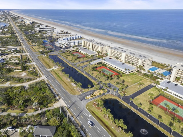 drone / aerial view featuring a view of the beach and a water view