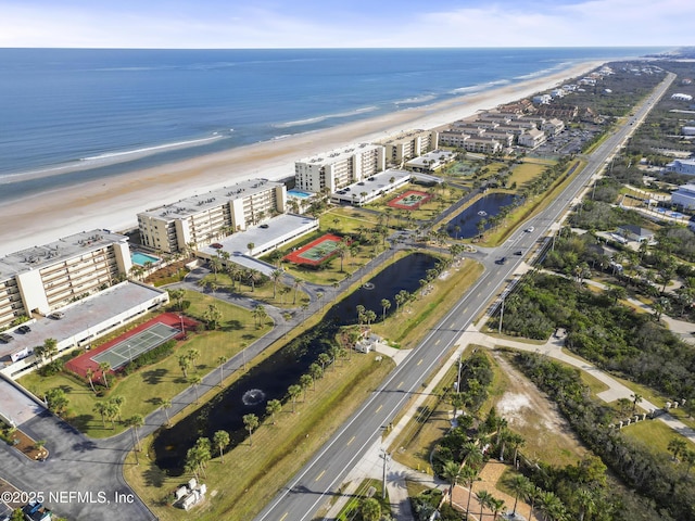 aerial view featuring a water view and a beach view