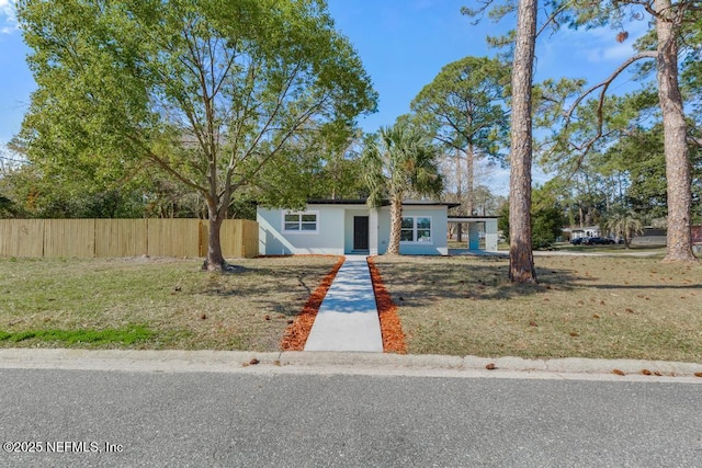 single story home featuring a front lawn