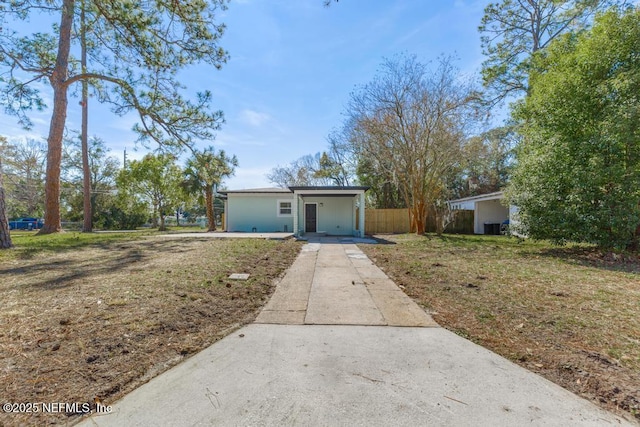 ranch-style home with a front lawn