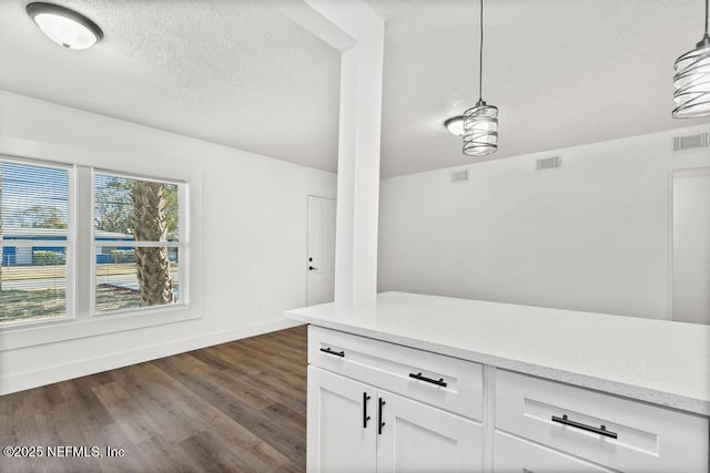 bar featuring white cabinetry, hanging light fixtures, light stone counters, and dark wood-type flooring