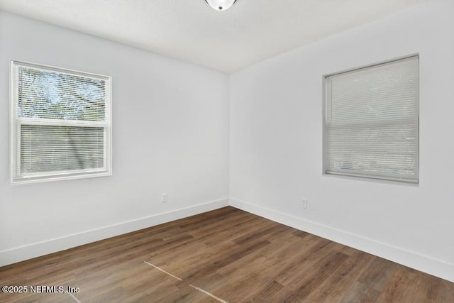 empty room featuring hardwood / wood-style floors