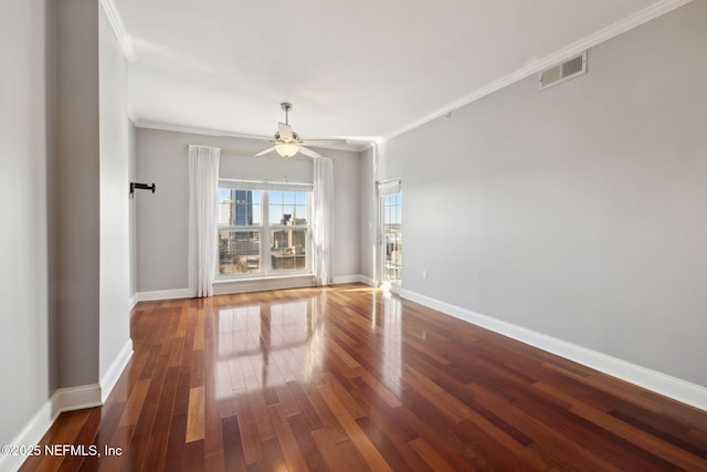 unfurnished room featuring crown molding, hardwood / wood-style flooring, and ceiling fan