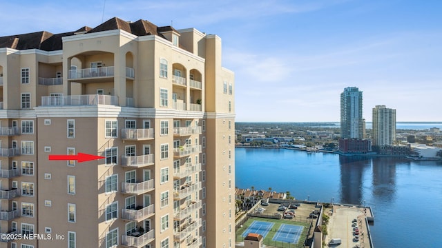 view of building exterior with a water view