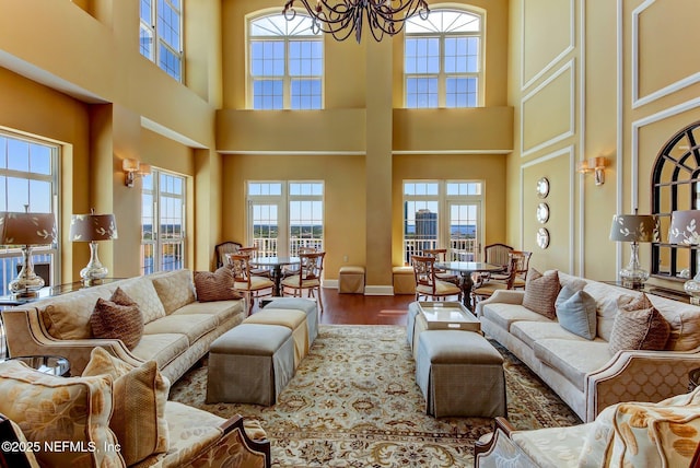 living room with hardwood / wood-style floors and a chandelier