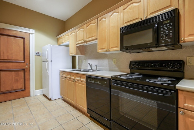 kitchen with sink, tasteful backsplash, light tile patterned floors, light brown cabinets, and black appliances