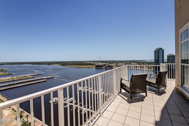 balcony featuring a water view