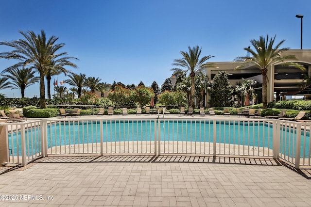 view of swimming pool featuring a patio area