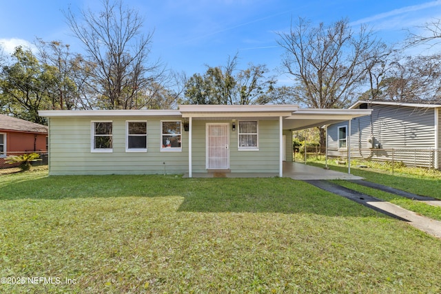 single story home with a carport and a front yard