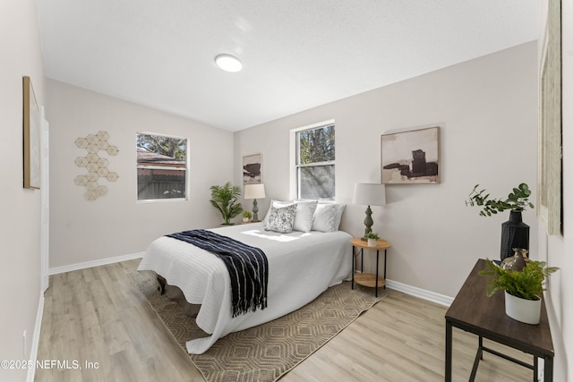 bedroom featuring light wood-type flooring