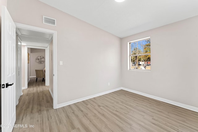 spare room with light hardwood / wood-style flooring