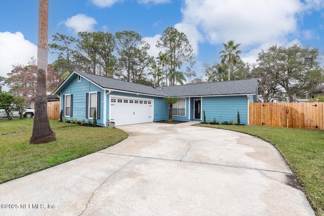 single story home featuring a garage and a front yard