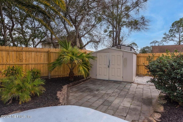 view of patio with a storage unit