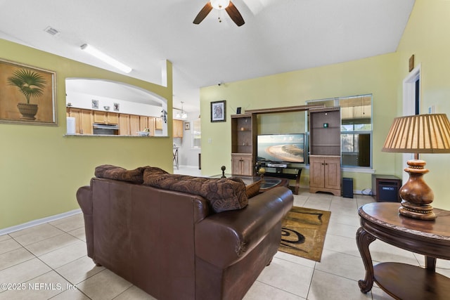 living room with light tile patterned flooring and ceiling fan