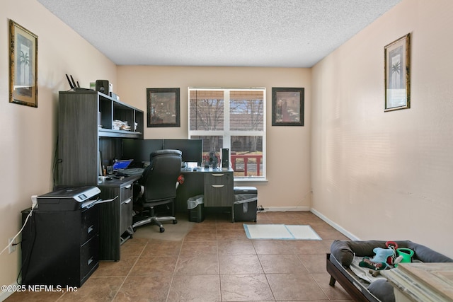 home office featuring tile patterned flooring and a textured ceiling