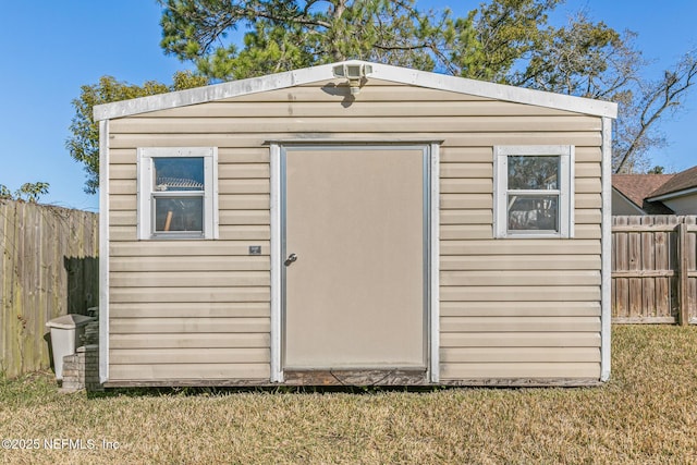 view of outbuilding with a lawn