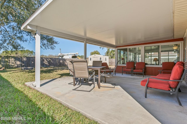 view of patio with a storage unit