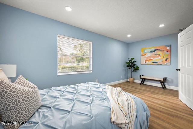 bedroom with wood-type flooring