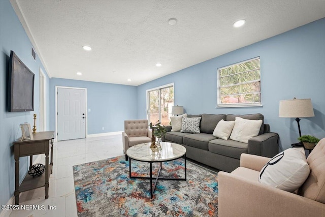 living room featuring a textured ceiling