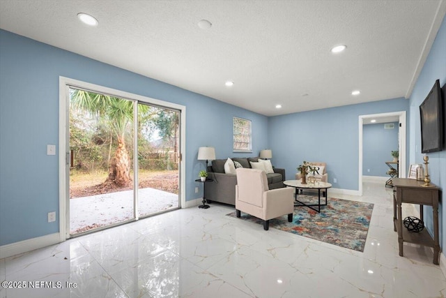 living room with a textured ceiling