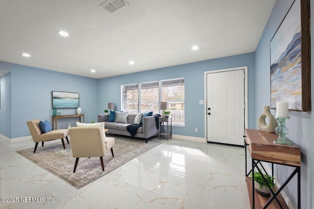 living room featuring a textured ceiling