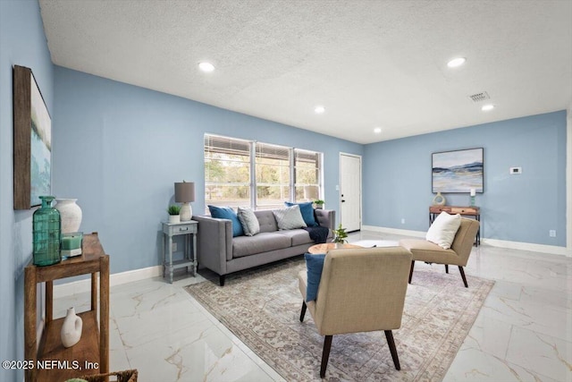 living room featuring a textured ceiling