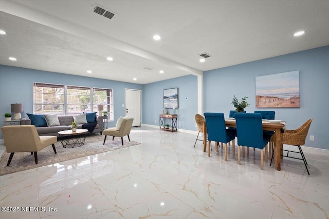 dining area with a textured ceiling