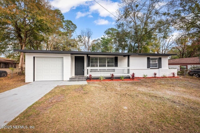 single story home featuring a garage, a front yard, and covered porch