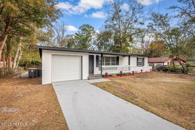 ranch-style home with a garage, a front lawn, and a porch