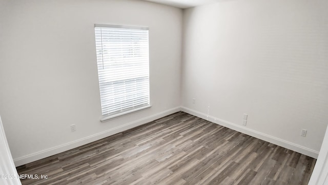 spare room featuring hardwood / wood-style floors