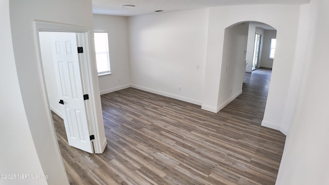 unfurnished room with wood-type flooring