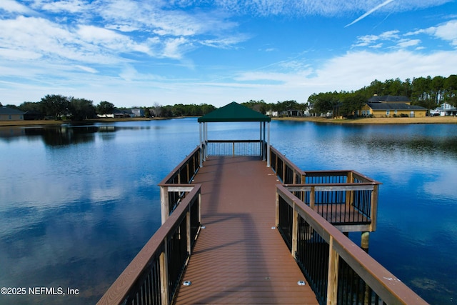 dock area featuring a gazebo and a water view