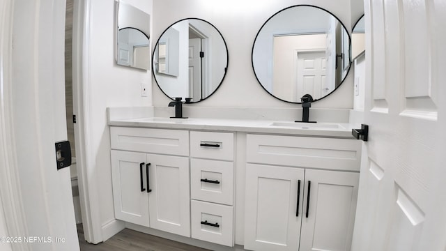 bathroom featuring vanity and hardwood / wood-style floors