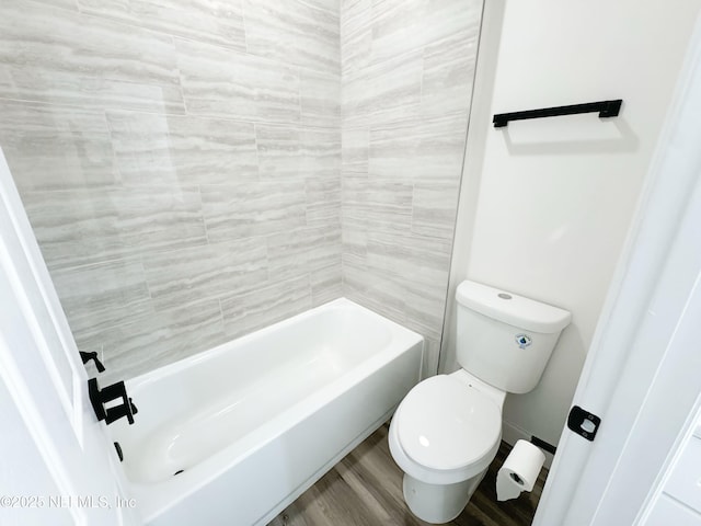 bathroom featuring hardwood / wood-style flooring and toilet