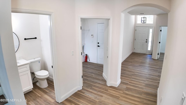 bathroom featuring vanity, toilet, and hardwood / wood-style floors