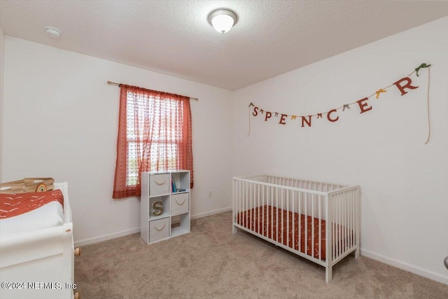 bedroom with carpet flooring and a textured ceiling