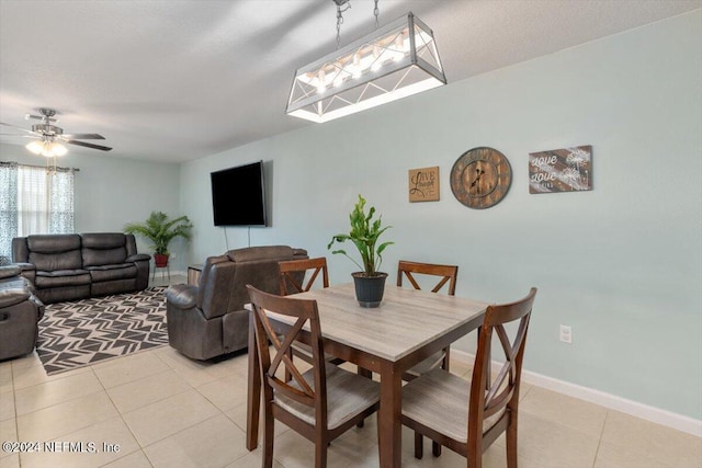 dining room featuring ceiling fan and light tile patterned floors