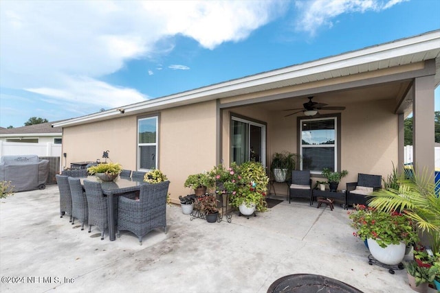 view of patio featuring an outdoor hangout area and ceiling fan