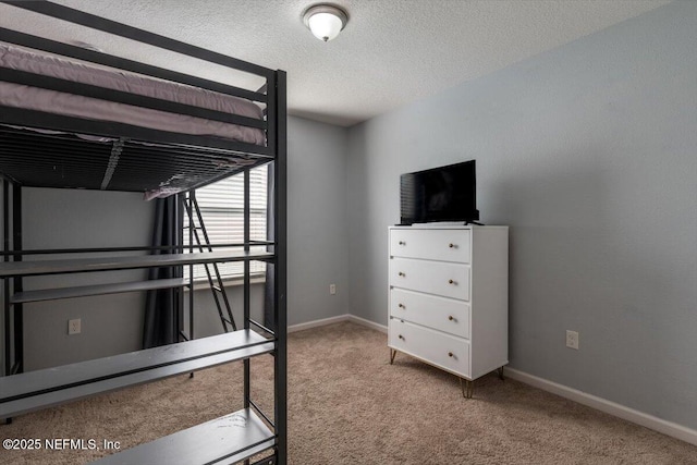 unfurnished bedroom featuring carpet and a textured ceiling