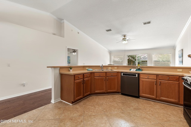 kitchen with sink, crown molding, dishwasher, vaulted ceiling, and kitchen peninsula