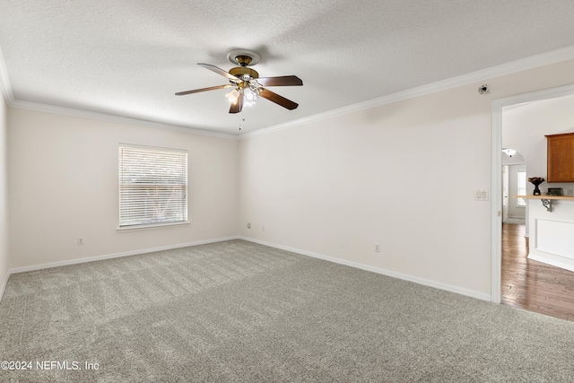 unfurnished room with crown molding, light colored carpet, ceiling fan, and a textured ceiling