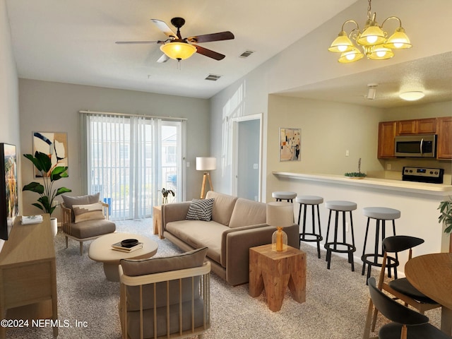 living room featuring ceiling fan with notable chandelier and light carpet