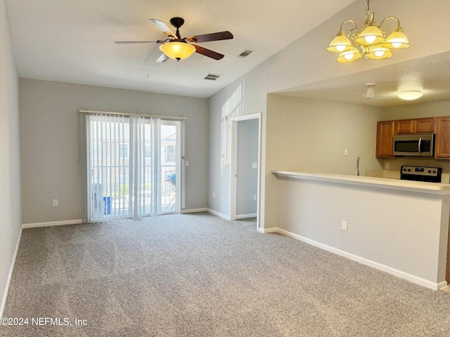 unfurnished living room featuring light carpet and ceiling fan with notable chandelier