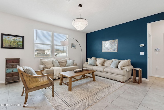 living room with light tile patterned floors and a chandelier