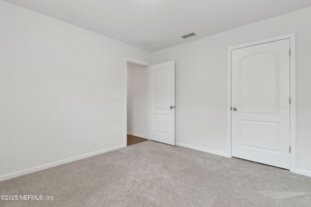 unfurnished bedroom with light carpet