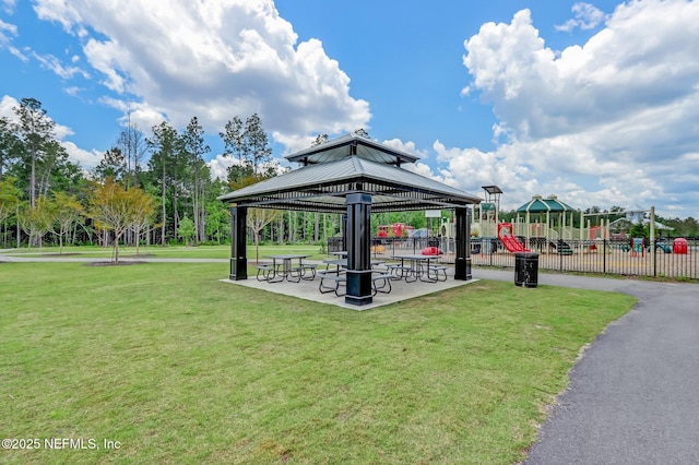 view of home's community with a yard, a gazebo, and a playground