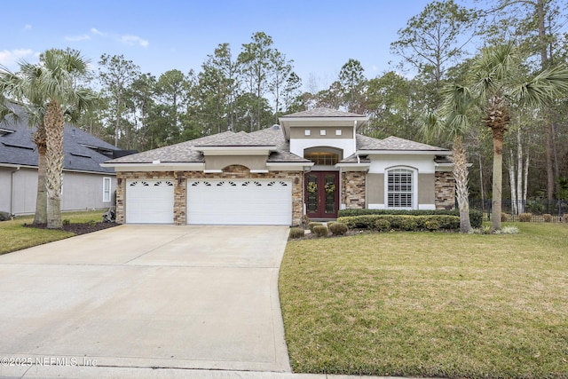 view of front of home with a garage, a front lawn, and french doors