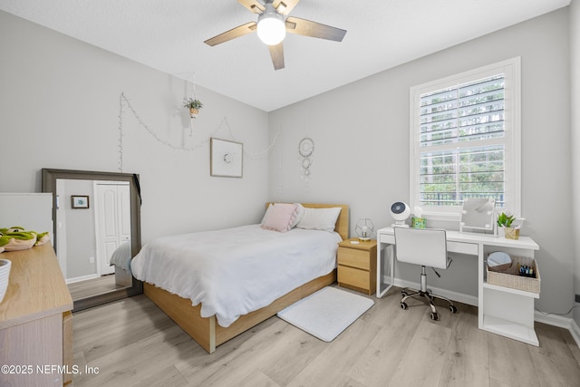 bedroom featuring ceiling fan and light hardwood / wood-style floors