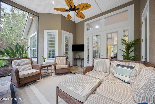 sunroom with french doors and ceiling fan