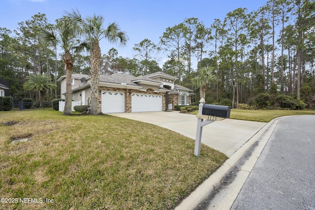 view of front facade featuring a garage and a front yard